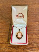 Necklace with pendant in open Rainbow box