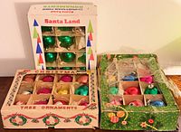 Three boxes of vintage Christmas ornaments displayed together