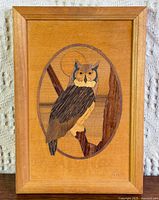 Front view of framed owl marquetry artwork
