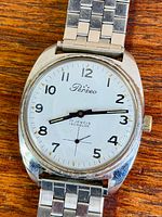 Front view of Perseo wristwatch showing dial, case and bracelet