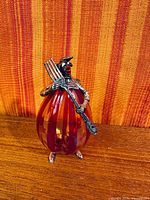 Front view of striped glass clown figurine with sterling silver details