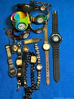 Overview of all watches laid out on blue background