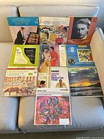 Overall group shot of the ten classical LP jackets displayed on a sofa