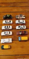 Overview of all eleven die-cast vehicles arranged in rows