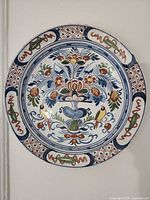 Full view of charger showing complete painted design and borders