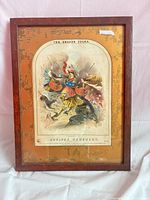 Full view of framed sheet music lithograph behind glass