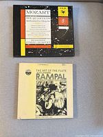 Front view of both vinyl box sets, closed