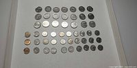 Full layout of 51 Dutch coins on white background
