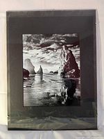 Frontal view of framed photograph with mat and glass