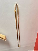 Full view of necklace hanging to show overall length and oval accent