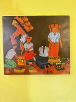 Full view of Guatemalan folk art painting on yellow wall