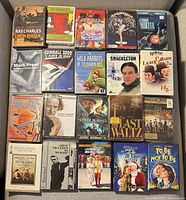 20 DVDs laid out in five-by-four grid showing variety of feature films, documentaries and concerts