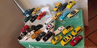 Overall group of diecast vehicles displayed on riser