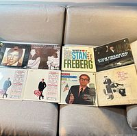 All ten LP jackets arranged on sofa