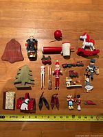 All ornaments laid out with measuring tape for scale