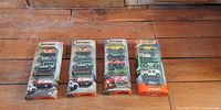Four sealed Matchbox 5-packs side by side