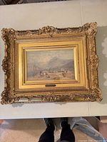 Full view of framed painting showing ornate gilt frame and overall size