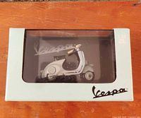 Front view of boxed 1:32 scale Vespa die-cast model scooter