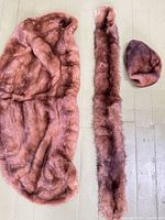 Cape, stole and hat laid flat showing overall form and matching fur