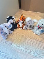 Group shot of all five Coca-Cola bean bag plush toys