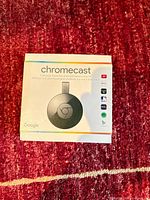 Front of retail box showing Chromecast image and branding