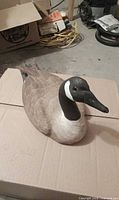 Top view of carved wooden Canada goose decoy