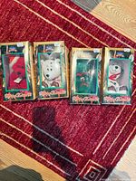 Group shot of four boxed Holiday Edition ’98 plush bears