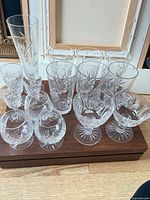 All 15 cut crystal pieces on wooden base