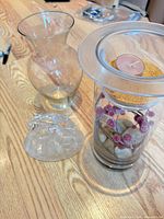 overview of vase, dolphin figurine, candle holder