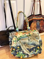 All three handbags grouped together showing size and styles