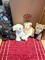 Group shot of all four plush animals