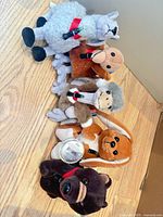 Five Coca-Cola plush animals lined up