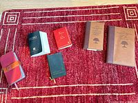 Six religious books laid out