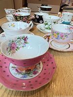 Group image showing assorted teacups and saucers, various patterns