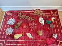 All ornaments laid out on rug for visibility of styles and count