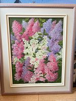 Front view of framed painting showing full floral composition