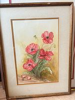 Front view of framed watercolor painting showing red poppies, mat and frame