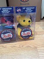 Front view of both Pepsi Bean Bears in cases