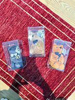 Top-down view of three boxed plush bears