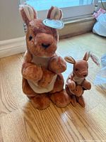 Both kangaroo plushes side by side