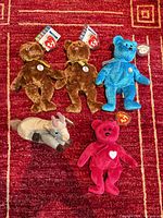 Group shot of all five Ty Beanie Babies on red carpet