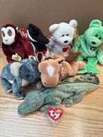Group shot of all 7 Beanie Babies showing overall condition and attached swing tags