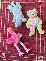Overview of three Ty Beanie Buddy plush toys