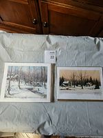 Both matted prints laid out side by side