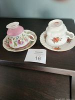 Both teacup and saucer sets upside down showing patterns