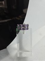 Ring front view showing two rows of rectangular amethysts