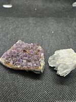 Amethyst and quartz clusters side by side