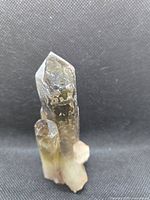 Front view of smoky quartz cluster showing multiple terminated points