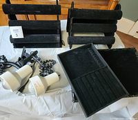 Overall lot showing two bracelet stands, two lights, two trays