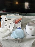 Paraffin bath, mitts, plastic bags, manual and box displayed together